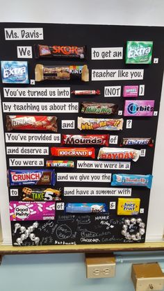 a bulletin board with candy bars on it