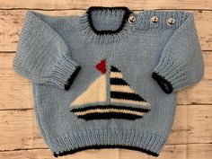 Hand knitted in Pale Blue Double Knitting Wool. Baby/Toddler Jumper with yacht detail at the front.  100% Acrylic. Fits approx. 12-24 months. Actual Measurements in pictures. Button opening detail on the shoulder with cute anchor buttons. Ideal Baby Shower gift. Knitting Wool, Boys Sweaters, Blue Hand, Knitted Baby, Baby Outfits, Clothing Sets, Double Knitting, Gender Neutral Baby, Baby Clothing