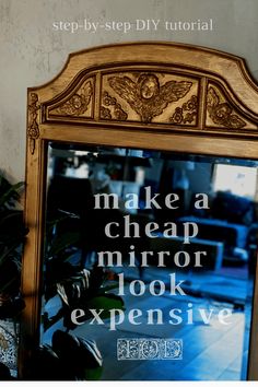 a mirror with words written on it in front of a plant and potted plant