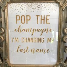 a framed sign that says pop the champagne i'm changing my last name