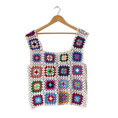 Discover the perfect blend of tradition and modern style with our Granny Square Top and Crochet Sweater Vest - a unique and versatile addition to any wardrobe. This Women's Crochet Granny Square Sweater Vest is a beautiful fusion of timeless crochet craftsmanship and contemporary fashion. Handmade with precision and care, this piece showcases intricate granny square designs that add a touch of vintage charm to your look. Not just for women, we also offer a Men's Sweater Vest in this collection, Granny Square Top Crochet, Sweater Vest Crochet, Crochet Granny Square Top, Vest Colorful, Pattern Sweater Vest, Crochet Granny Square Pattern, Granny Square Top, Square Sweater, Crochet Sweater Vest