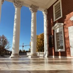 an empty building with columns and windows