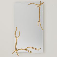 a mirror that has some branches on it