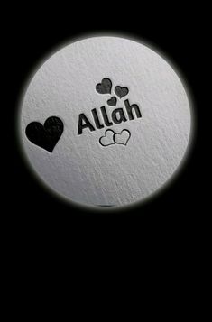 a white round with black hearts and the word alah written in arabic on it