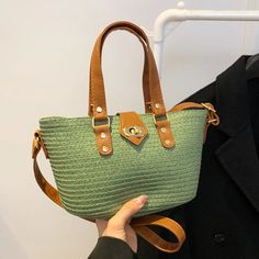 Green Woven Tote Bag with Leather Straps Trendy Green Bucket Bag With Adjustable Strap, Green Straw Shoulder Bag For Summer, Green Leather Shoulder Bag For Summer, Casual Green Bucket Satchel, Trendy Green Bucket Bag With Large Capacity, Trendy Large Capacity Green Bucket Bag, Trendy Green Large Capacity Bucket Bag, Casual Straw Shoulder Bag With Top Handle, Trendy Green Bucket Bag For Daily Use