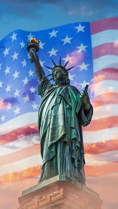 the statue of liberty is shown with an american flag in the background