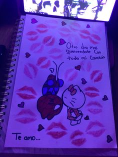 a notebook with a drawing of a ladybug holding a heart