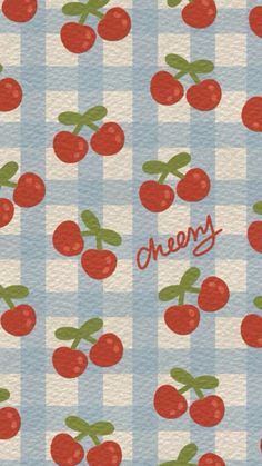 an image of cherries on a blue and white checkered tablecloth with the word cherry written in red