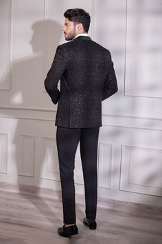 Black full sleeves shawl lapel collar tuxedo with all over starlet embroidery using tonal cutdana and nalki highlights. Paired with a trouser. - Aza Fashions Elegant Winter Night Out Sets, Elegant Winter Sets For Night Out, Elegant Black Suits For Holiday Season, Party Wear Long Sleeve Suits, Elegant Bandhgala With Sequins For Festive Occasions, Elegant Festive Bandhgala With Sequins, Elegant Sequined Bandhgala For Festive Occasions, Elegant Fitted Outerwear For Festive Occasions, Elegant Sequin Blazer For Festive Occasions