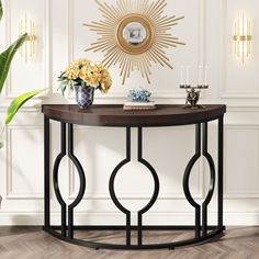 a console table with flowers on top