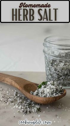 homemade herb salt in a wooden spoon next to a glass jar filled with it and text overlay that reads homemade herb salt