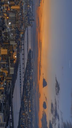 an aerial view of the beach and city lights