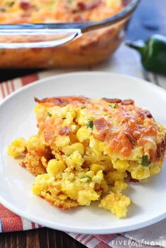 an omelet is on a plate with a fork