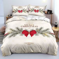 a bed with christmas decorations and bows on it