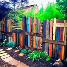 a colorful fence made out of wooden boards