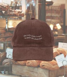 D E T A I L S Life is pain...au chocolat ;) M A T E R I A L S * 100% cotton corduroy * Unstructured, 6-panel, low-profile * Cotton twill sweatband and taping * 6 embroidered eyelets * Adjustable strap with a gold-colored metal buckle P O L I C I E S - Because our items are made to order, please note that we do not accept returns or exchanges - No changes can be made to your order once it is placed! Fulfillment is done by another company and your order may ship in parts - Please feel free to ask any questions about your order! We love chatting with our fellow aesthetic enthusiasts! S H I P P I N G This product is made especially for you as soon as you place an order, which is why it takes us a bit longer to deliver it to you. Making products on demand instead of in bulk helps reduce overpro Dark And Light Academia Aesthetic, Wavy Letters, How To Have Style, Trendy Caps, Embroidered Corduroy, English Teacher Gifts, Corduroy Cap, Cold Girl, Light Academia Aesthetic