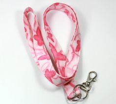 This cute lanyard has beautiful butterflies with pink ribbons. It is perfect for any occasion. You can leave me a convoy if you need a different size. You can have a wardrobe of lanyard to match your outfit. This lanyard is made of soft 100% cotton fabric to give a comfortable feel around your neck. This lanyard is easy to take care. You can spot clean and throw in a washer and hang dry. If you want you can iron and it is ready to use. These lanyards are perfect if you have metal allergy. Each o Lanyard Pink, Pink Lanyard, Cute Lanyard, Cute Lanyards, Custom Lanyards, Fabric Lanyard, Have Metal, Pink Butterfly, Badge Holder