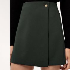 Features Invisible Zipper At Side With Hook-And-Eye Closure Materials & Care Content: 95% Polyester, 5% Spandex Care: Machine Wash Imported Model Wearing Black, The Actual Skirt Is In Red High-waist Skort For Workwear In Fall, High Waist Skort For Workwear In Fall, Short Skirt With Side Zipper For Work, Green Short Skirt For Fall, Short Green Skirt For Fall, Workwear Skirt With Side Zipper For Fall, Fall Workwear Skirt With Side Zipper, Fall Green Mini Skirt For Work, Fall Skirt With Side Zipper