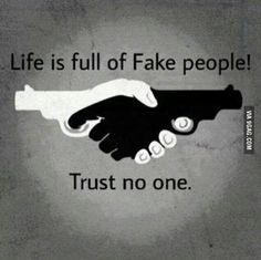 two hands shaking each other with the words, life is full of fake people trust no one