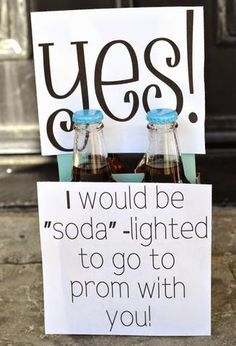 two beer bottles sitting in front of a sign that says yes i would be soda - lighted to go with you