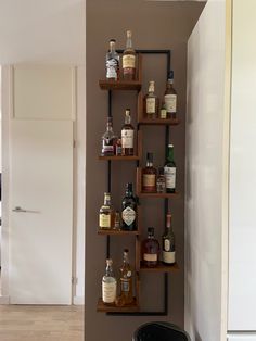 a wall shelf with liquor bottles on it