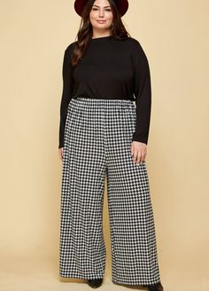 Houndstooth wide leg palazzo pants with elastic hem. These pants are ready to take on the day and spice it up! No more boring black dress pants- texture is in! Runs true to size. Questions about fit? Email Support@LillaCavallo.com for additional help with choosing the perfect size for you! Curvy Work Outfit, Houndstooth Pants, Spice It Up, Professional Outfits Women, Wide Leg Palazzo Pants, Business Pants, Plus Size Pants, Black Dress Pants, Curvy Outfits