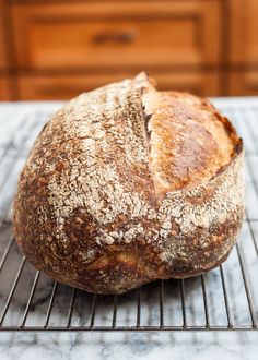 a loaf of bread sitting on top of a cooling rack