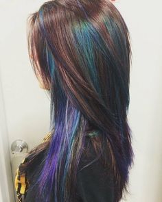 Peekaboo geode hair Blue And Purple Peekaboo Highlights, Peekaboo Hair Color Layers, Multicolor Highlights For Dark Hair, Colored Peekaboo Highlights, Brunette Peekaboo Color, Pikaboo Hair Color, Mermaid Hair Color Peekaboo, Peekaboo Hair Color Brunettes, Geode Hair