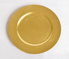 an empty gold plate on a white background