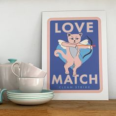 a cat holding a bow and arrow with the words love match on it