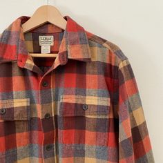 Thick woven plaid shirt with buttons up the front and two chest pockets. Pre-loved item. Excellent used condition. Brand: L.L.Bean Size on tag: Men's L. See measurements. Chest: 50" Length: 32.5" Shoulders: 20" Sleeves: 25" Please allow 0.5" margin of error for measurements, they are taken by hand. Material: 100% cotton. Wash: Machine wash warm. Tumble dry low. Made in: El Salvador. Casual Plaid Button-up Camp Shirt, Casual Plaid Camp Shirt With Camp Collar, Fall Cotton Button-up Camp Shirt, Vintage Plaid Flannel Shirt With Pockets, Men’s Accessories, Shirt With Buttons, Plaid Shirt Men, Mens Oxfords, Ll Bean