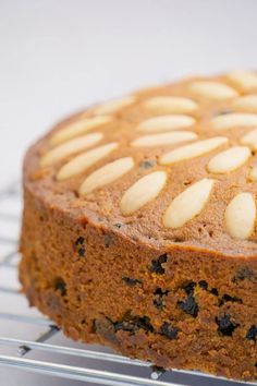 a close up of a cake on a cooling rack