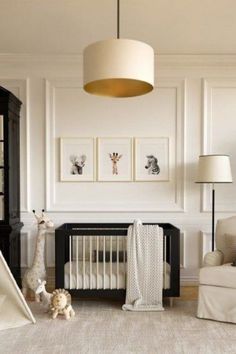 a baby's room with white walls and furniture