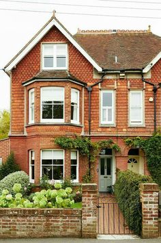 a large brick house with many windows