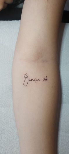 a woman with a tattoo on her arm that says, bersea st in cursive writing