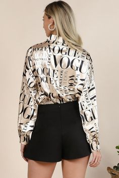 -Satin Fabric Vogue Print -Collar Button Down -Long Sleeves with Button -Loose Fit (Chest: 30", length: 27") -Made in USA Satin fabric vogue print, collar, loose fit button up shirt top. Model wear S. Model: 5'10" 34-24-3 95% Poly, 5% Spandex Hand wash Model is wearing a small MODEL STATS Height: 5.6"Bust:34" / Waist:25" / Hips:41" See Sizes in Size Chart Casual Beach Wear, New Arrival Dress, Shop Swimwear, Top Model, Shirt Top, Button Up Shirt, Satin Fabric, Bottoms Pants, Set Dress