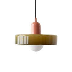 an orange and white light hanging from a ceiling fixture with a black cord attached to it