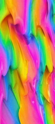 multicolored paint is being used to create an abstract pattern in this image, it appears to be very colorful