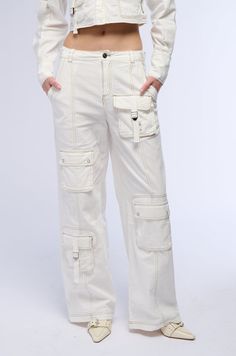 Nailing the trends in The AKIRA Label Aced It Wide Leg Cargo Pant. These slightly stretchy cotton bottoms feature a high rise waist, functional belt loops, contrast stitching, faux hematite metallic hardware, waist-cinching buckled straps at the sides, and a wide leg silhouette. Complete with side slant front pockets, one back zippered pocket and one snap button flap back pocket, two buckled strap cargo pockets on the front as well as two snap button flap pockets, and a front zip button closure. For a finished look, style with the coordinating AKIRA Label Aced It Long Sleeve Cargo Button Down.  - Shell: 100% Cotton - Some Stretch - Imported  (all measurements are approximate from size small) - 12” Rise - 31” Inseam - Model is 5’9” Product ID: 391934  (all measurements are approximate from Cotton Bottoms, Cargo Pant, Cinched Waist, Flap Pocket, Snap Button, Casual Pants, Wide Leg, High Rise, Size Small