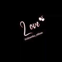 the words love are lit up against a black background with an apple logo on it