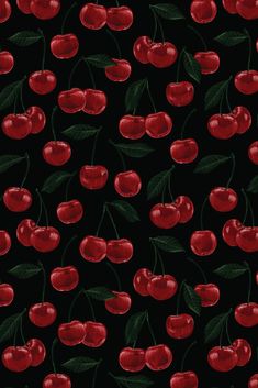 a black background with red cherries and leaves