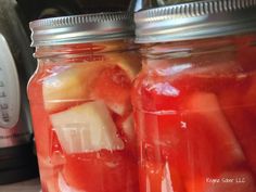 two mason jars filled with watermelon and apple slices next to an instant pressure cooker