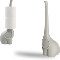 an elephant shaped toothbrush holder next to a giraffe shaped toothbrush holder