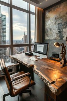 a wooden desk with a computer on it in front of large windows overlooking the city