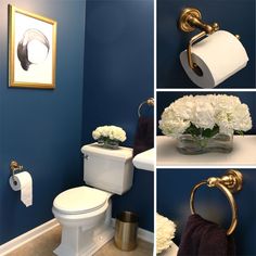 the bathroom is decorated with blue walls and white flowers in vases on the toilet