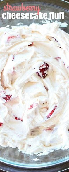 a close up of a plate of food with cream cheese and strawberries on it