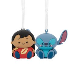 two cartoon ornaments hanging from strings on a white background