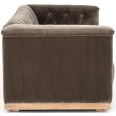 a brown couch sitting on top of a wooden frame