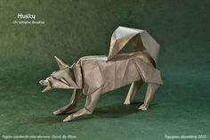 an origami animal is standing on the ground