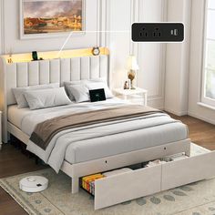 a bed with drawers underneath it in a room